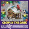 Bits and Pieces – 300 Piece Jigsaw Puzzle for Adults – Festive Feathered Friends - Glow - in - The - Dark Holiday Birdhouse Christmas Pine Tree Lights Jigsaw Puzzle by Artist Alan Giana
