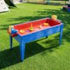 Constructive Playthings Indoor/Outdoor Sand and Water Activity Table for Kids Ages 1-3, Portable Classroom Play Table with Dry-Erase Top and 2 Side Trays, Blue/Red