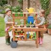HONEY JOY Mud Kitchen with Wheels, Fir Wood Outside Play Kitchen for Toddlers, Realistic Faucet & Water Tank, 15 Garden Tools, Storage Shelf, Planter Cups, Mud Table for Kids Outdoor Backyard,Natural