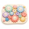 Juju Pastel Spinning Gear Builders Set – Interlocking Gear Pieces with Smiling Faces Base Plates Axles and Hand Crank – Color Motion Desk Kit