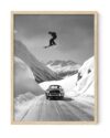 Jumping the Car Ski Wall Art 18x24 Framed Poster Ready to Hang Black and White Skier Over Vintage Sports Car Alpine Mountain Photography for Ski Resort Cabin Lodge Garage Man Cave Décor