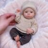 RBBABY 6" Lifelike Mini Premium Solid Silicone Baby Dolls Girl, Cuddly Asleep Tiny Newborn Babies, Soft Full Body Realistic Baby Dolls Real Life Dolls with Clothes Set & Feeding Accessories