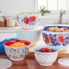 A 10-piece set of printed melamine nesting mixing bowls with snap-on lids that are scratch-resistant and shatterproof. Perfect for meal prep, parties, picnics, and family gatherings.