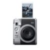 instax mini 99 instant film camera, with colour effects, Brightness control, Landscape/Normal/Macro modes, uses instax mini film. Silver colour finish