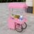 GRIPITHPY Rolling Dessert Display Cart with Canopy, Metal Food Vendor Cart with Lockable Casters & Storage Cabinet, Candy Flower Serving Stand Carts for Outdoor Market Party(L 120cm/47.2in, PinkA)