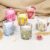 Simply Indulgent 7 oz Fragrance Blended Soy Wax Candle Set in Floral Glass Vessel, 6-Pack